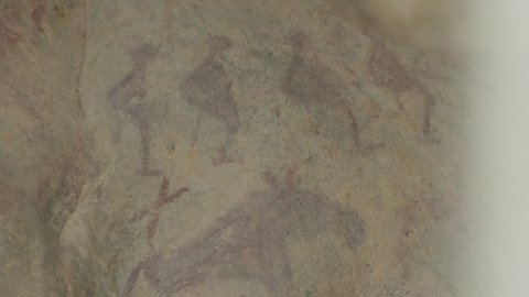 Early human art, petroglyph of humans and animals