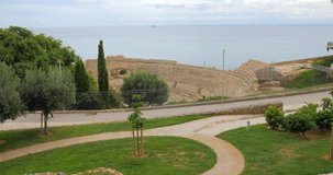 A beautiful and well maintained park near Tarragona roman Amphitheatre captured in a 4k video shoot during daylight. Day light tarragona amphitheatre panorama 4k spain.