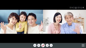 Asian family talking on a two-screen video call. Video phone.