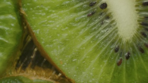 Fresh sliced kiwi fruit rotating. Closeup macro shot. Fresh berry series. Kiwi in macro.