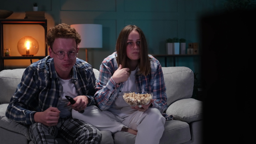 Couple watching sports game on TV