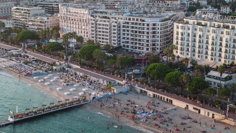 Establishing Aerial View Shot of Cannes French Riviera Fr, French Riviera, Alpes-Maritimes, France, holidaymakers getting suntan