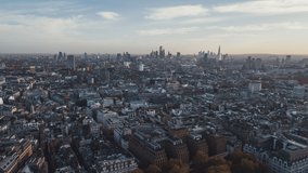 Establishing Aerial View Shot of London UK, United Kingdom, mega wide, push in, autumn in the city
