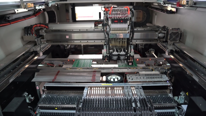 Production of high techonology circuit board. Close up making circuit board.