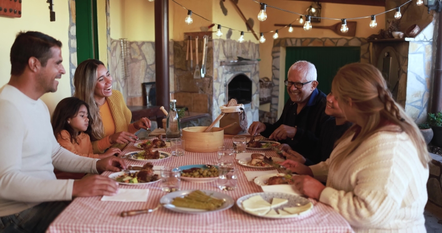 Latin family enjoy meal at home