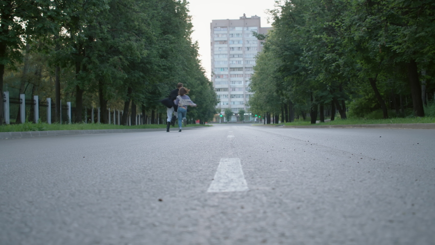Video of happy running couple in early empty morning