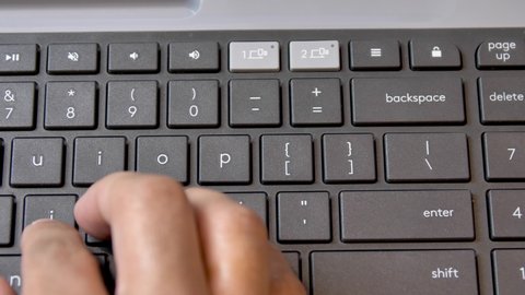 Man typing and pressing backspace on the keyboard