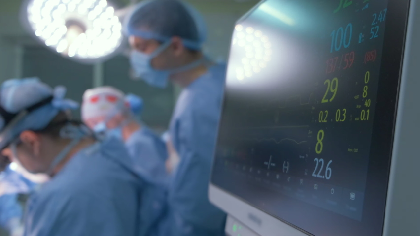 Heart rate and patient control monitor in hospital theater room during surgery operation Royalty-Free Stock Footage #1083186451