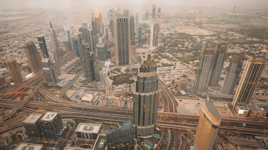 Dubai, UAE, United Arab Emirates. 4K time lapse. Day to Night timelapse. Change Transition To Night. City Traffic Under Khalifa Tower.