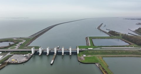 Houtrib sluices along the dike and road between Lelystad towards Enkhuizen. Dutch infrastructure along the water Makermeer and Ijselmeer