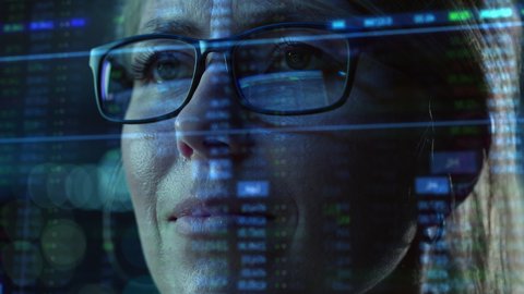 Portrait of Female Digital Entrepreneur Working on Computer, Line of Code Projected on His Face and Reflecting in Glasses. Developer Working on Innovative e-Commerce App using AI and Big Data