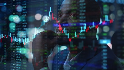 Portrait of Black Stock Market Trader Doing Analysis of Investment Charts, Graphs, Ticker Numbers Projected on His Face. African American Financial Analyst, Digital Entrepreneur Successfully Trading