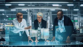Green Energy Car Design: Diverse Team of Automotive Enginers Using Augmented Reality Hologram to Construct 3D Model of High-Tech Electric Engine Turbine. Futuristic Automated Robot Arm Manufacturing - Powered by Shutterstock - Get 15% off with code: PIKWIZARD15