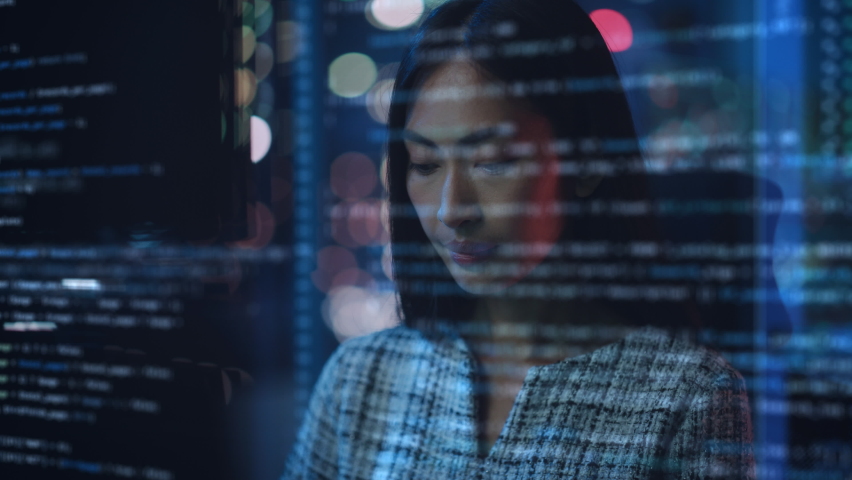 Portrait of Asian Female Startup Digital Entrepreneur Working on Computer, Line of Code Projected on His Face and Reflecting. Software Developer Working on Innovative e-Commerce App using AI, Big Data Royalty-Free Stock Footage #1083199081