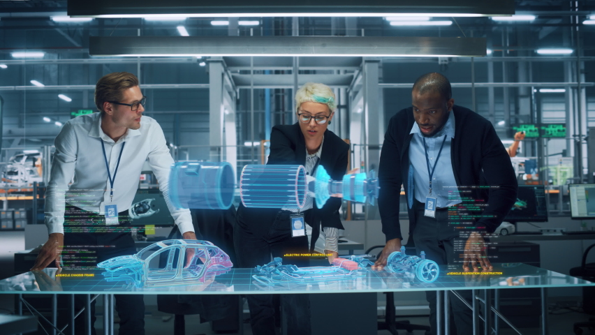 Green Energy Car Design: Diverse Team of Automotive Engineers Using Augmented Reality Hologram to Construct 3D Model of High-Tech Electric Vehicle Optimizing Engine. Automated Robot Arm Manufacturing - Powered by Shutterstock - Get 15% off with code: PIKWIZARD15