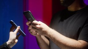 Man controller scanning QR code on smartphone, nightclub security. Covid vaccination passport control, digital certificate on phone. Visiting bars during coronavirus, green zone.  - Powered by Shutterstock - Get 15% off with code: PIKWIZARD15