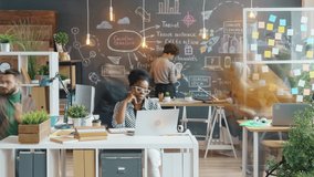 Time lapse of diverse group of businesspeople working in creative office talking cooperating moving around. Workplace and employees concept. - Powered by Shutterstock - Get 15% off with code: PIKWIZARD15