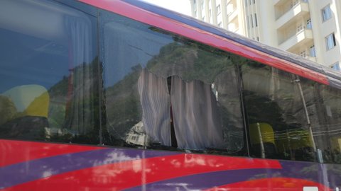 Rio de Janeiro, Brazil - 2021 23 21: Broken window on our bus in Rio de Janeiro. Somebody smashed our window during a night in Rio de Janeiro.