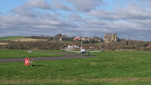 Shoreham, West Sussex, UK, November 16, 2021. Piper PA 28 161 Cherokee Warrior  III G-CLWB arriving at Brighton City Airport with Lancing College and the South Downs in the background.