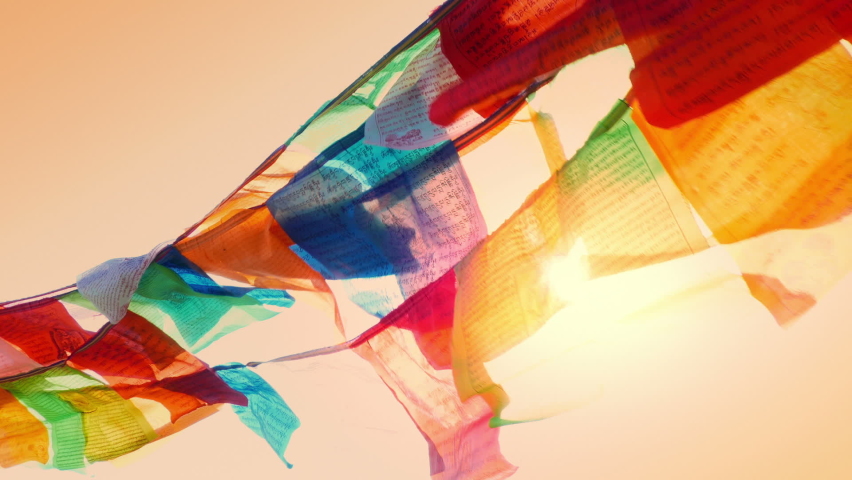 Wind Blows Prayer Flags At Sunset