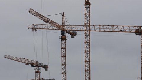 hamburg, hamburg, germany - 13 09 2021: construction cranes moving in the sky