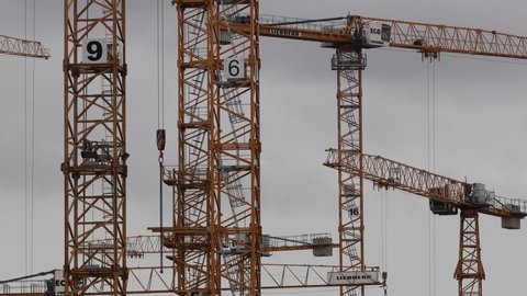 hamburg, hamburg, germany - 13 09 2021: construction cranes moving in the sky