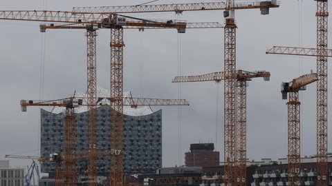 hamburg, hamburg, germany - 13 09 2021: construction cranes in front of the elbphilharmonie hamburg