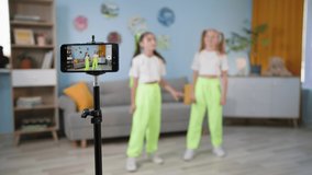 video blogging, teen girls filming blog and social media video content in room at home, kids hobby