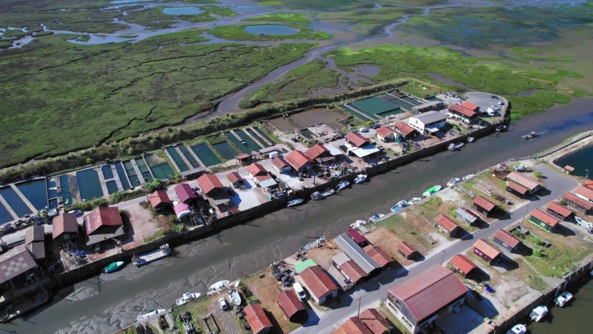 Stunning view over a fishing port and the huts the fishermen use. High angle.