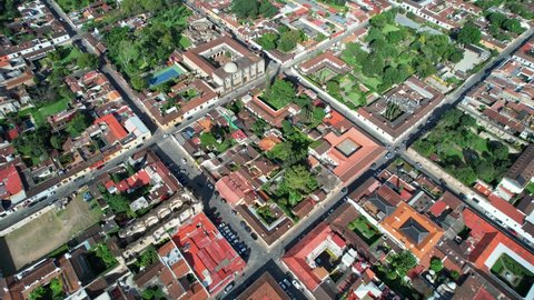 Antigua, Guatemala. 4K Drone. Colonial Town City Block Streets With Red Rooftops And Green Trees.