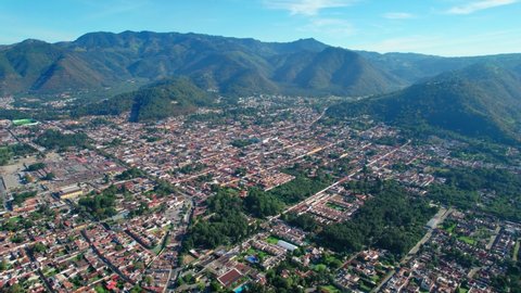 Antigua, Guatemala. 4K Drone. Central American Colonial Town Surrounded By Lush Green Mountains.