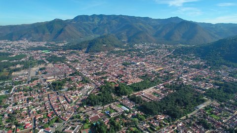 Antigua, Guatemala. 4K Drone. Central American UNESCO town surrounded by mountains.