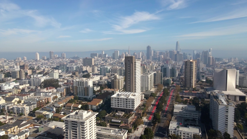 Aerial view overlooking the Lower Pacific Heights and the Fillmore district, sunny fall day in San Francisco, USA - reverse, drone shot
