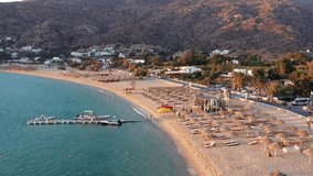 aerial view of mylopotas with private beach in ios island. Ios island is located in the Cyclades group in the Aegean Sea. luxury accommodation in greece Video.