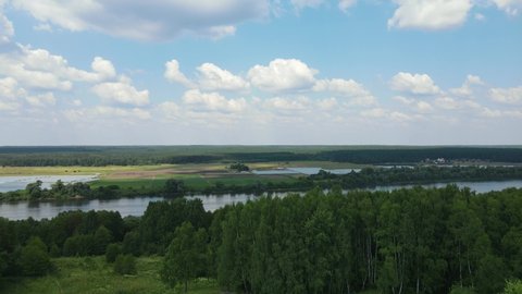 Russia, Pushchino. Aerial video of a drone flying over the Oka River at sunny day. A river in the European part of Russia, the largest right tributary of the Volga River.
