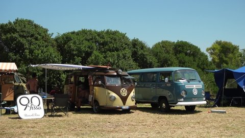 Santa Severa, Italy - July 20, 2019: restored volkswagen vans near a beach on the Roman coast. Became an international symbol in the hippy period