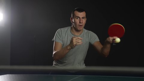 table tennis. man a athlete playing ping pong. sport party tournament concept. sportsman lifestyle man training playing table tennis. forehand and backhand exercise in ping pong
