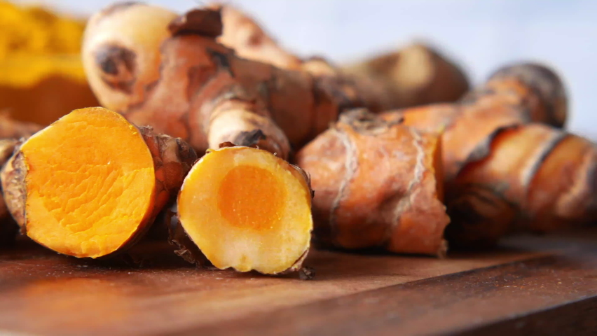 detail shot of turmeric root in bowl on table , Royalty-Free Stock Footage #1083233434