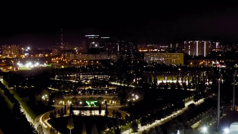 Dolly zoom. Krasnodar, Russia. Public park - Krasnodar. Flying over the park at night, Aerial View
