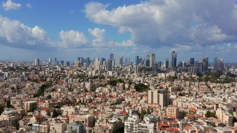 Tel Aviv skyline over neighboring Bnei Brak lower houses, Aerial view.