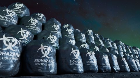 Seamless looping shot with countless black biohazard trash bags full of dangerous waste. Medical, biomedical of infectious solid or non-sharp waste disposal. Waste storage in dark plastic bags. Night.