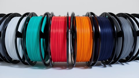 Multicoloured filament spools of plastic. Printing on a 3D printer. 3D printing motley different colours thermoplastic filament. Additive technology. Motley wire plastic for 3d printer. Seamless loop.