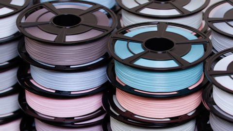 Multicoloured filament spools of plastic. Printing on a 3D printer. 3D printing motley different colours thermoplastic filament. Additive technology. Motley wire plastic for 3d printer. Seamless loop.