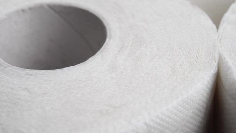 Roll toilet paper. Soft hygienic clean rolled towels. Round textured form. Macro. Rotation