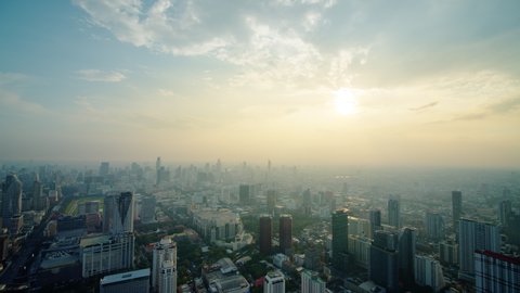 On sunset time, a high angle video footage 300 meters from the ground with a ultra wide angle lens in Bangkok, Thailand.