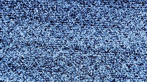 distorted white static noise interference on a small portable analog TV with a cathode ray tube, full frame real time