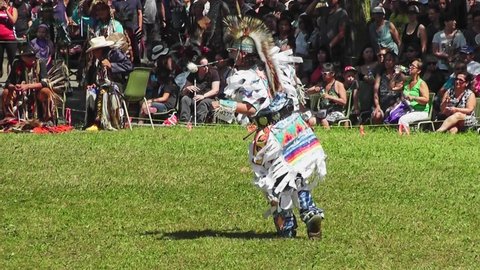 Kahnawake, Quebec, Canada - July 9, 2017
Native American young man with participating at a dance contest at Kahnawake  Pow Wow on the Mohawk reserve in July 2017, with traditional music