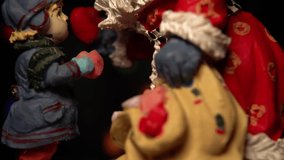 Christmas concept.
Macro shot of Santa Claus delivering gifts to a child.
Christmas time