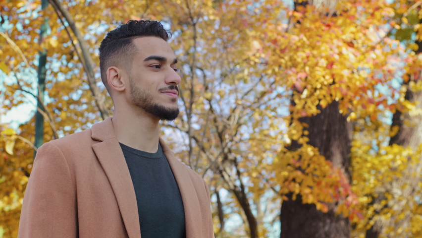 Meeting man and woman in autumn park couple hugging tightly on date outdoors lovers smile happily young guy communicates with curly girl close-up lady embracing beloved boyfriend joyful enamored talk Royalty-Free Stock Footage #1083280042
