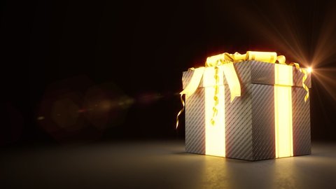 gold - black beautified present box on dark backdrop